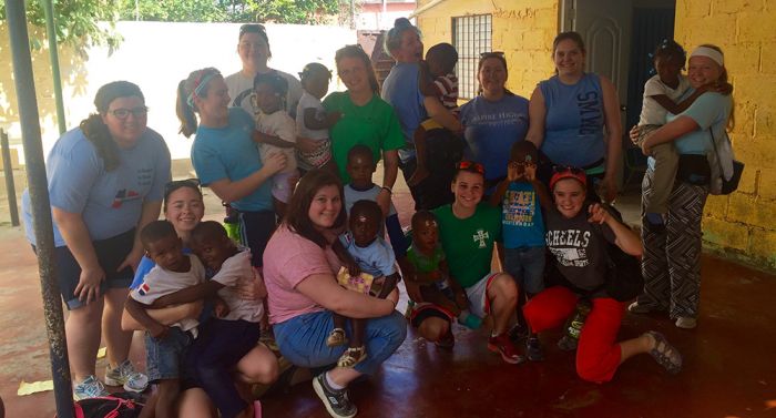 Saint Mary-of-the-Woods College (SMWC) students volunteered at Spring in the Desert Preschool in the Dominican Republic. Back row (l to r): Maribeth Allen, Erin Harnett, Stephanie McIntyre, Madison Brehob, Madeline McCue, Haylie Davenport, Nyctasia Fitton
