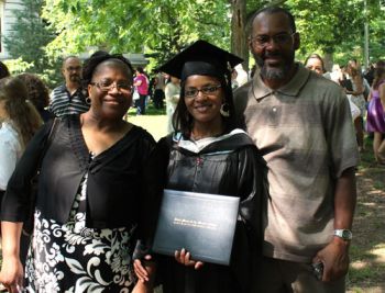 parents with graduate holding diploma