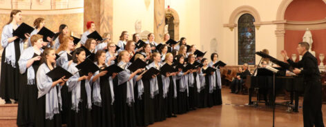 Choral students singing at a concert